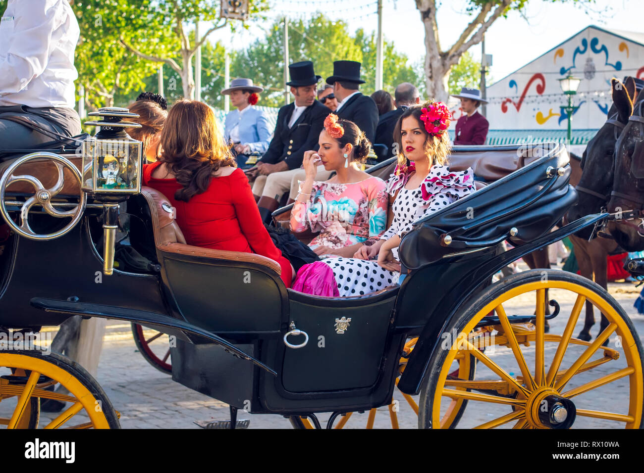 Beautiful Women In Traditional And Colorful Dress Travelling In A Horse ...