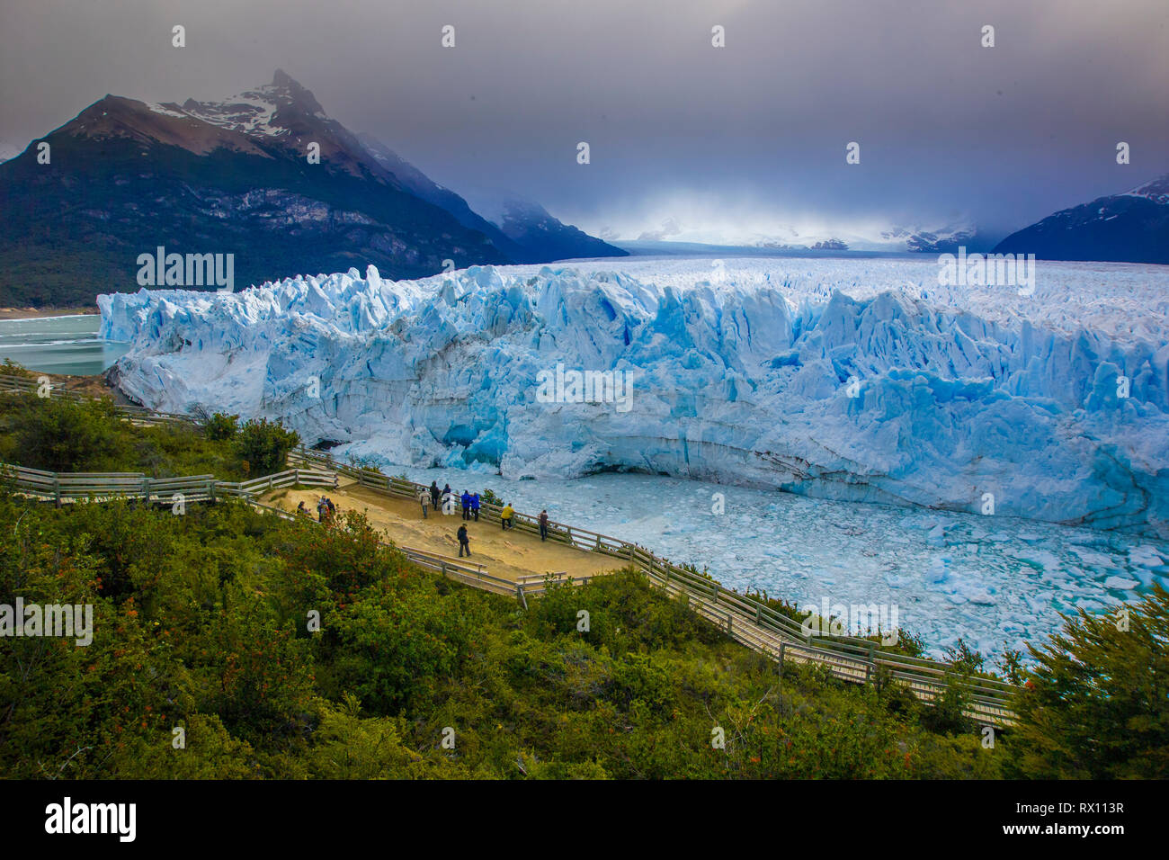 PERITO MORENO, ARGENTINA, 12-16-2005.tourits admire the the edge of glacier from a safe view point Stock Photo