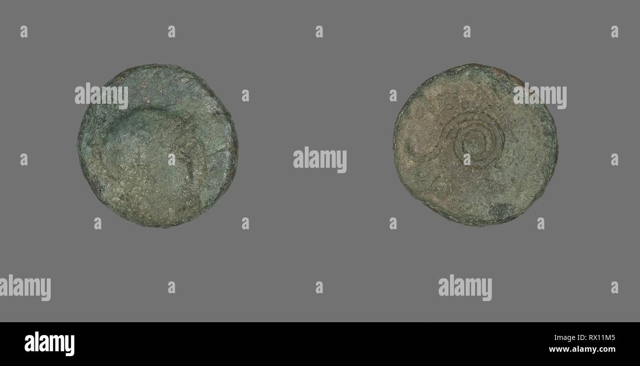 Coin Depicting the Goddess Athena. Greek. Date: 159 BC-138 BC. Dimensions: Diam. 1.6 cm; 2.74 g. Bronze. Origin: Ancient Greece. Museum: The Chicago Art Institute. Stock Photo