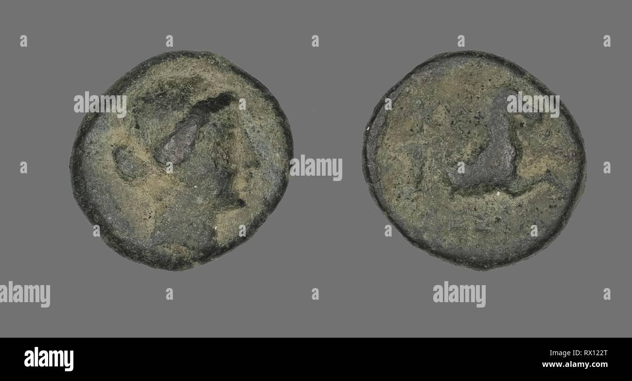 Coin Depicting the Amazon Cyme. Greek. Date: 250 BC. Dimensions: Diam. 1.5 cm; 3.04 g. Bronze. Origin: Ancient Greece. Museum: The Chicago Art Institute. Stock Photo