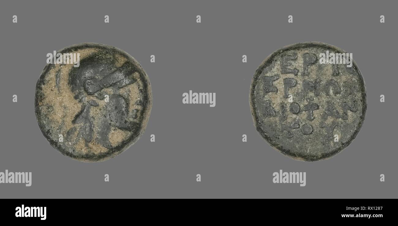 Coin Depicting the Goddess Athena. Greek. Date: 300 BC-200 BC. Dimensions: Diam. 1.1 cm; 2.32 g. Bronze. Origin: Ancient Greece. Museum: The Chicago Art Institute. Stock Photo