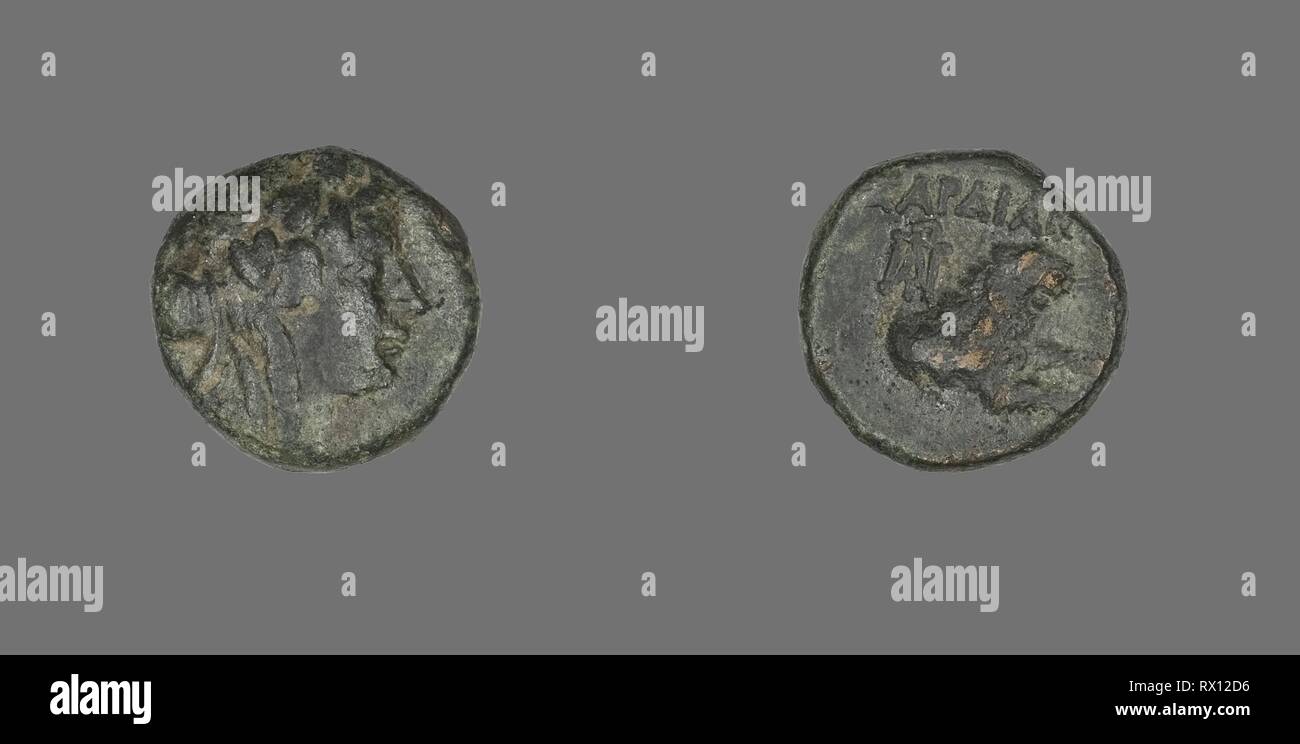 Coin Depicting the God Dionysos. Greek. Date: 133 BC. Dimensions: Diam. 1.6 cm; 4.39 g. Bronze. Origin: Ancient Greece. Museum: The Chicago Art Institute. Stock Photo