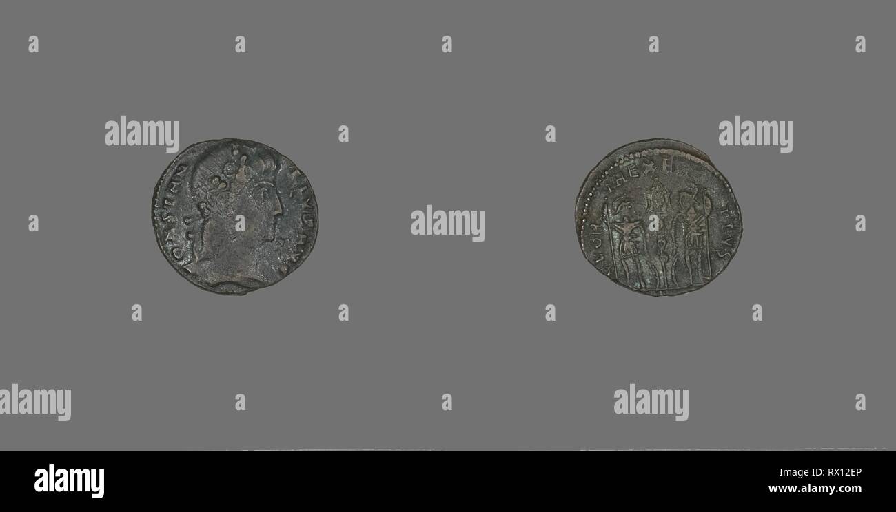 Coin Portraying Emperor Constantius II. Roman. Date: 337 AD-361 AD. Dimensions: Diam. 1.5 cm; 1.39 g. Bronze. Origin: Ancient Mediterranean. Museum: The Chicago Art Institute. Stock Photo