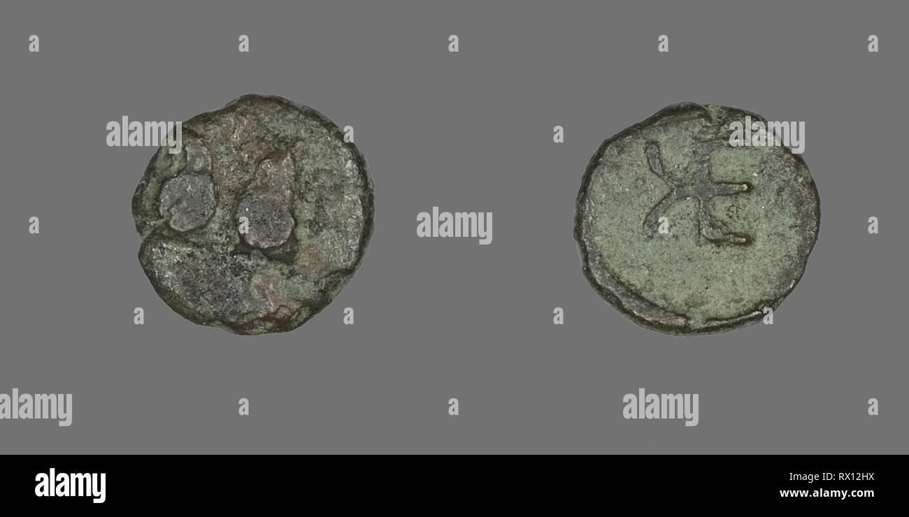 Coin Depicting Two Rams. Greek. Date: 400 BC-310 BC. Dimensions: Diam. 1 cm; 0.72 g. Bronze. Origin: Ancient Greece. Museum: The Chicago Art Institute. Stock Photo
