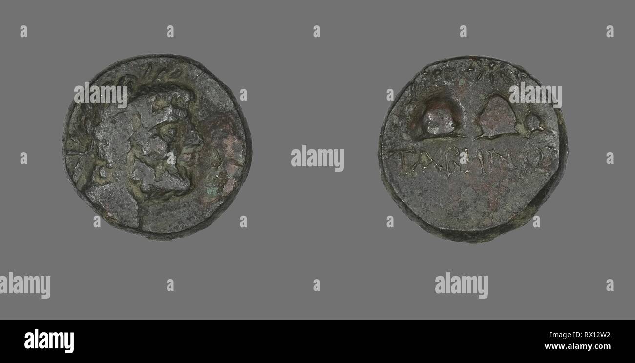 Coin Depicting the God Zeus. Greek. Date: 100 BC-1 BC. Dimensions: Diam. 1.9 cm; 6.72 g. Bronze. Origin: Ancient Greece. Museum: The Chicago Art Institute. Stock Photo