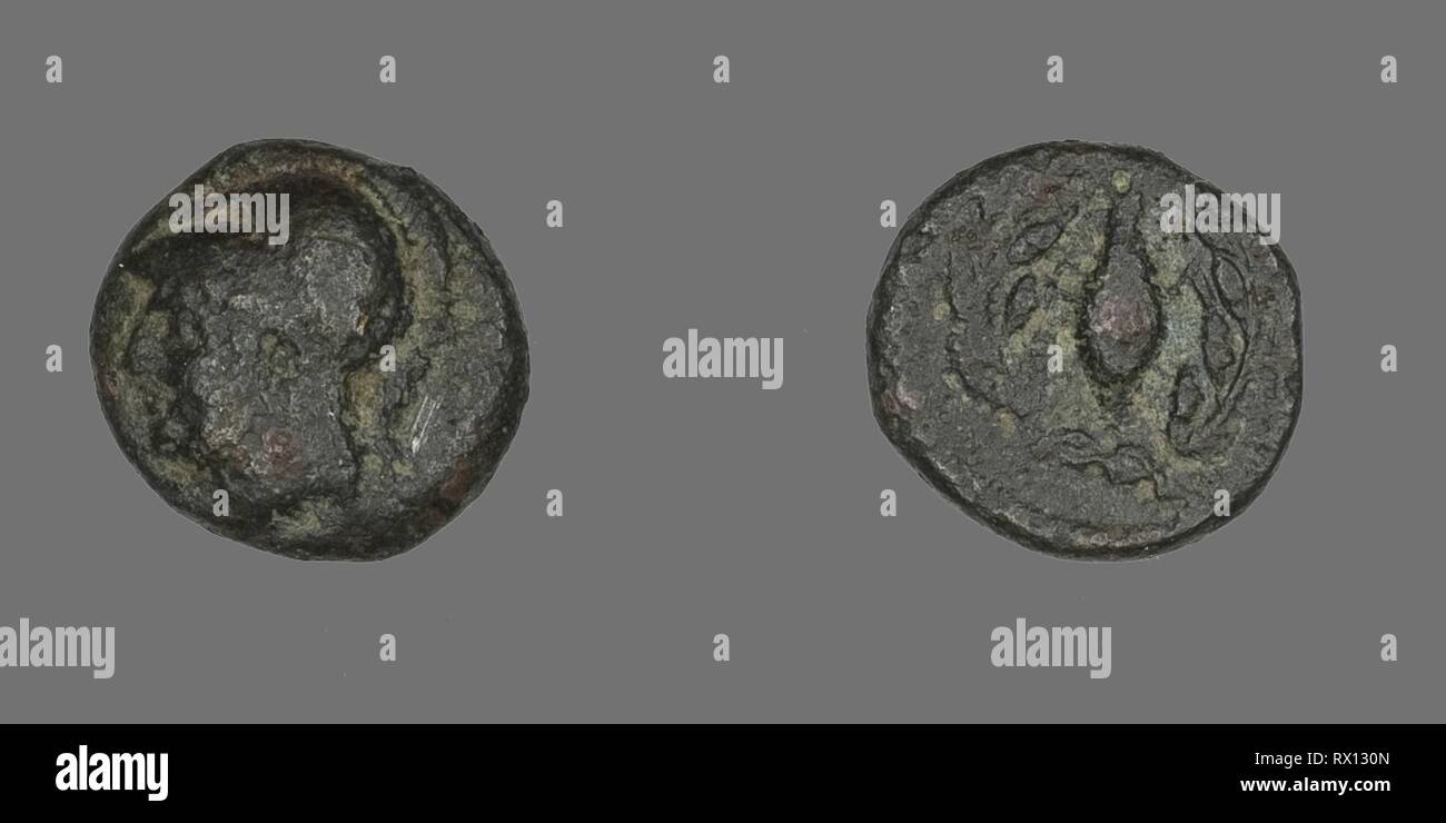 Coin Depicting the Goddess Athena. Greek. Date: 340 BC. Dimensions: Diam. 1.1 cm; 1.38 g. Bronze. Origin: Ancient Greece. Museum: The Chicago Art Institute. Stock Photo