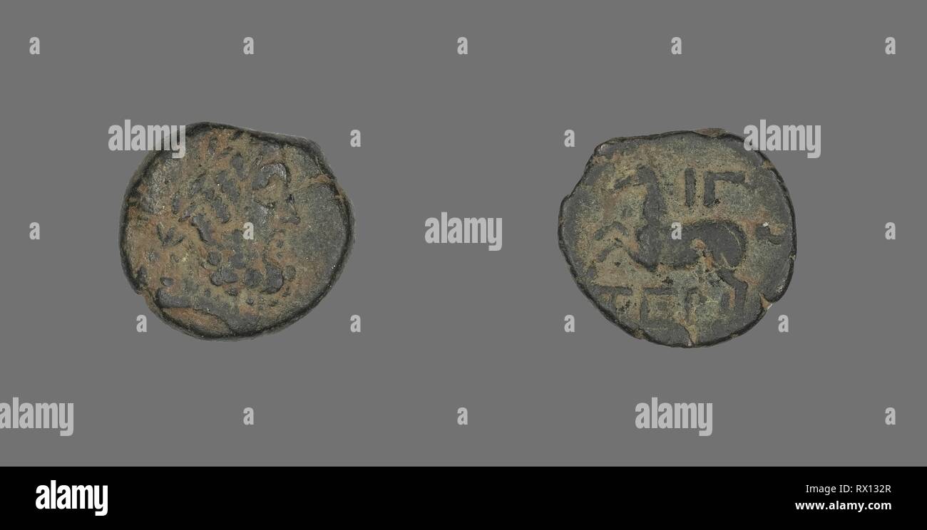 Coin Depicting the God Zeus. Greek. Date: 58 BC. Dimensions: Diam. 1.6 cm; 2.83 g. Bronze. Origin: Ancient Greece. Museum: The Chicago Art Institute. Stock Photo
