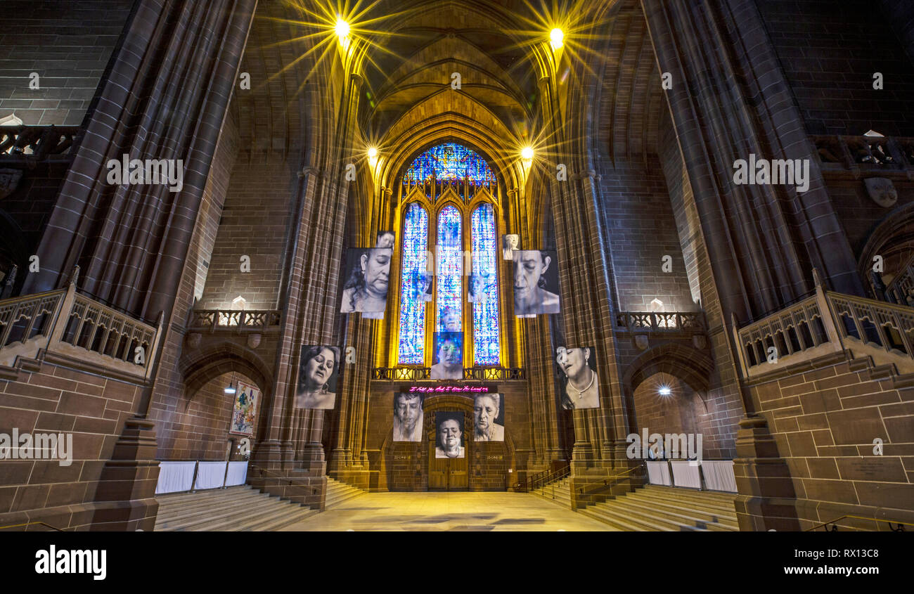 Sudarios Shrouds by Erika Diettes on display for the first time in the United Kingdom. Portraits of women who watched family members murdered are suspended inside Liverpool Cathedral from the 8th - 28th March as part of RISE Festival to celebrate inspirational and extraordinary women. Stock Photo