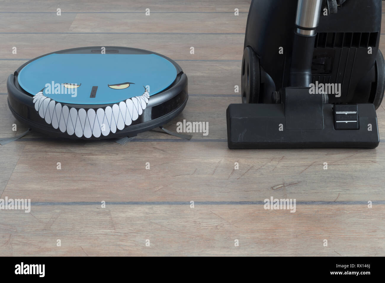 Robot Vacuum Cleaner With Evil Eyes And Grin And Regular Vacuum