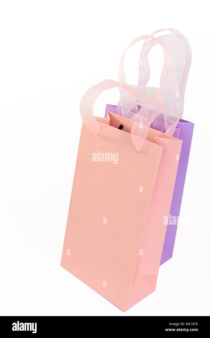 Pastel pink and lilac shopping bags isolated on white Stock Photo - Alamy