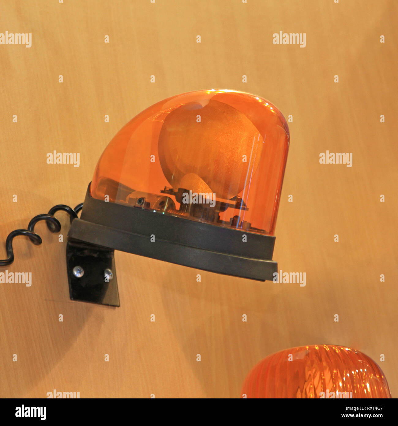 Amber Orange Rotating Light in Plastic Dome Stock Photo