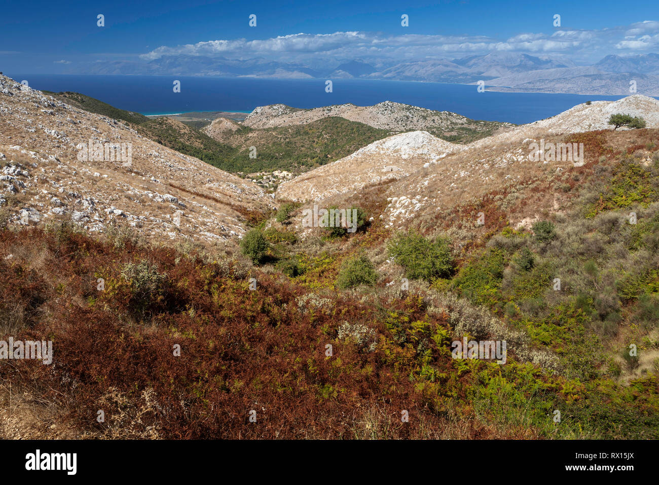 Aerial view over mountains to the rural road and Ionian sea, Pantokrator mountain foothill, Corfu, Greece Stock Photo