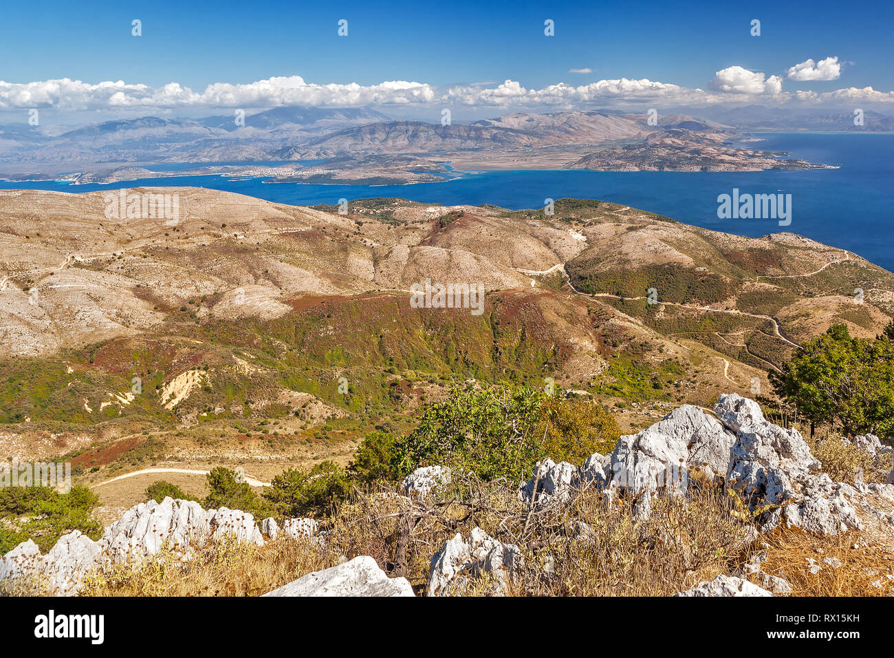 Aerial view over mountains to the rural road and Ionian sea, Pantokrator mountain foothill, Corfu, Greece Stock Photo