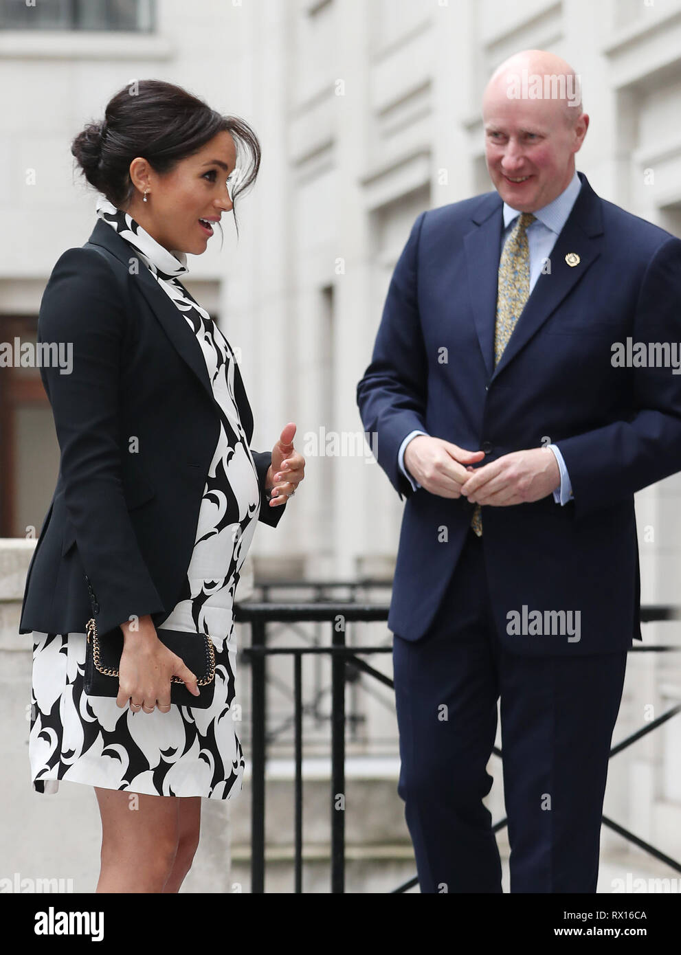 The Duchess of Sussex is greeted by Lord Geidt, former Private