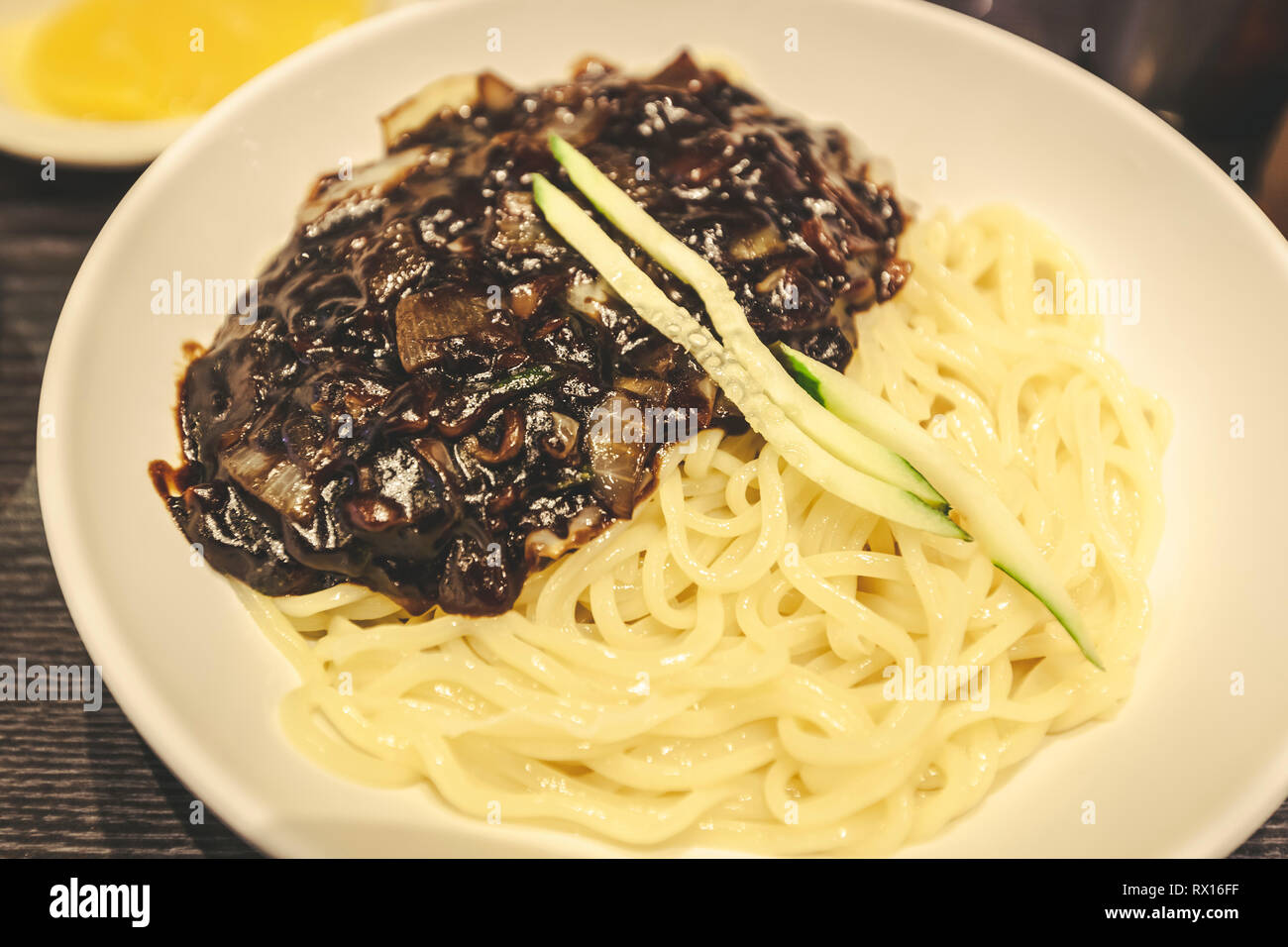 Close up of Jajangmyeon (jjajangmyeon), Chinese Korean traditional noodle dish with diced pork