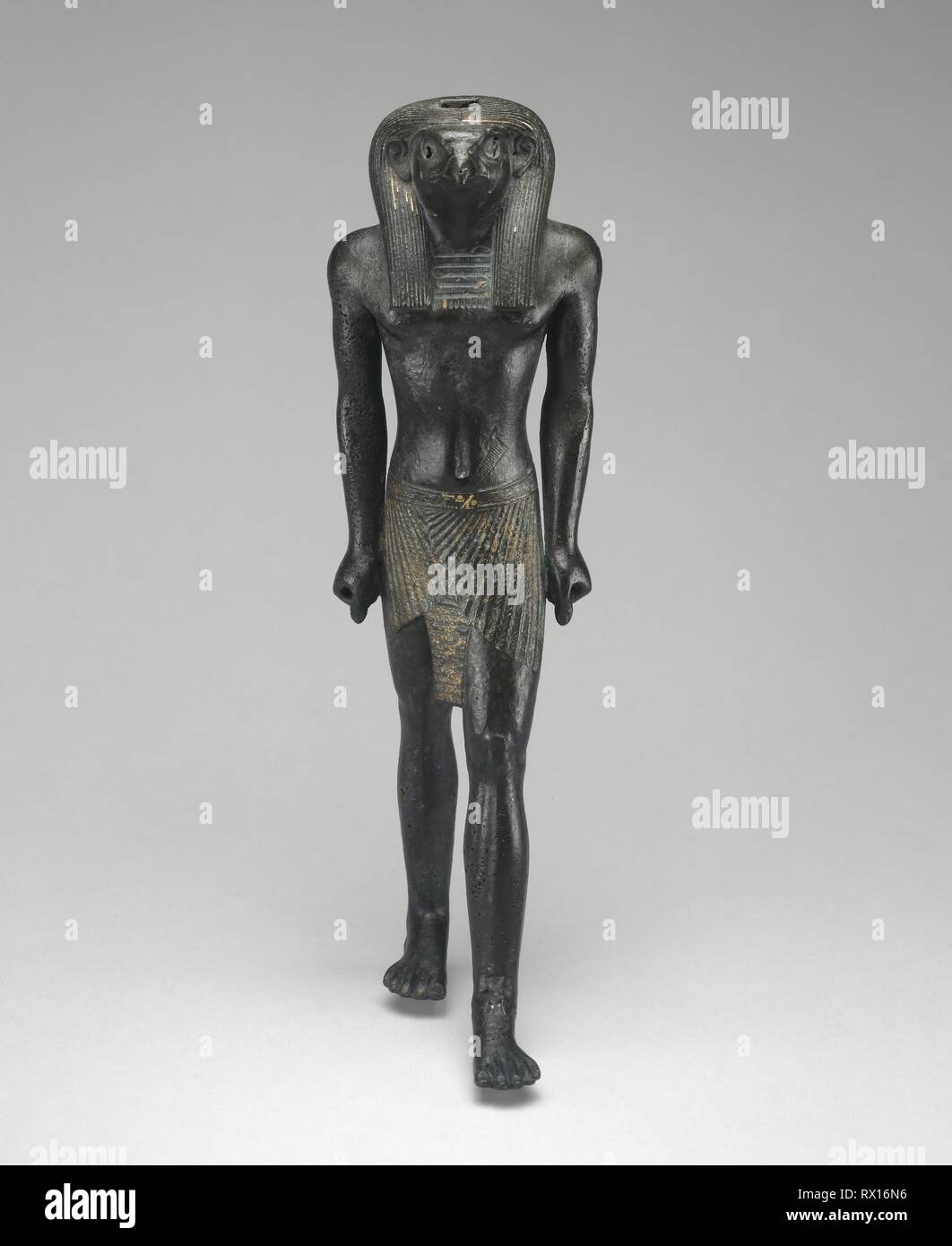 Statuette of Re-Horakhty. Egyptian. Date: 1069 BC-664 BC. Dimensions: 25 × 8.3 × 10.5 cm (9 7/8 × 3 1/4 × 4 1/8 in.). Copper alloy with gilding. Origin: Egypt. Museum: The Chicago Art Institute. Author: Ancient Egyptian. Stock Photo