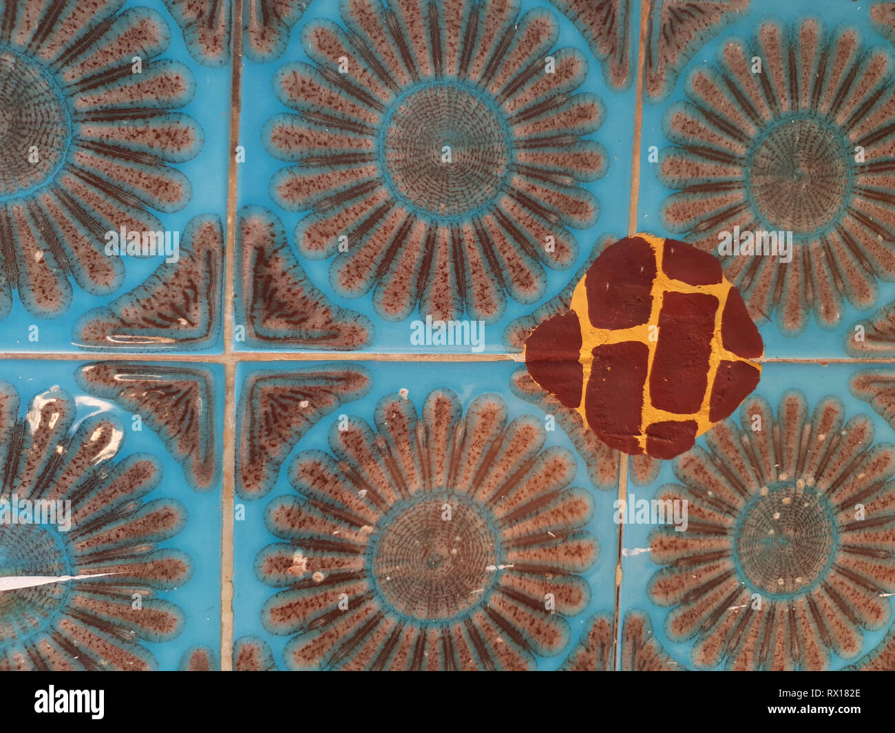 Vintage ceramic tile blue color with brown pattern Stock Photo - Alamy