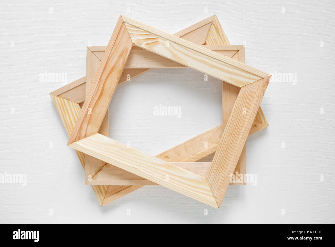 Wooden stretcher bars on white artist canvas background. Top view. Stock Photo