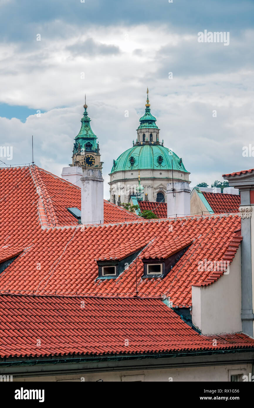 St. Nicolas church and roofs of Prague Stock Photo