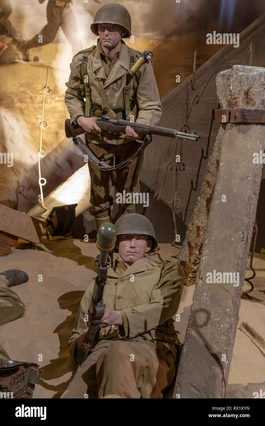 Two American solider mannequins in a display in the Overlord Museum, Lotissement Omaha Center, Colleville-sur-Mer, France. Stock Photo