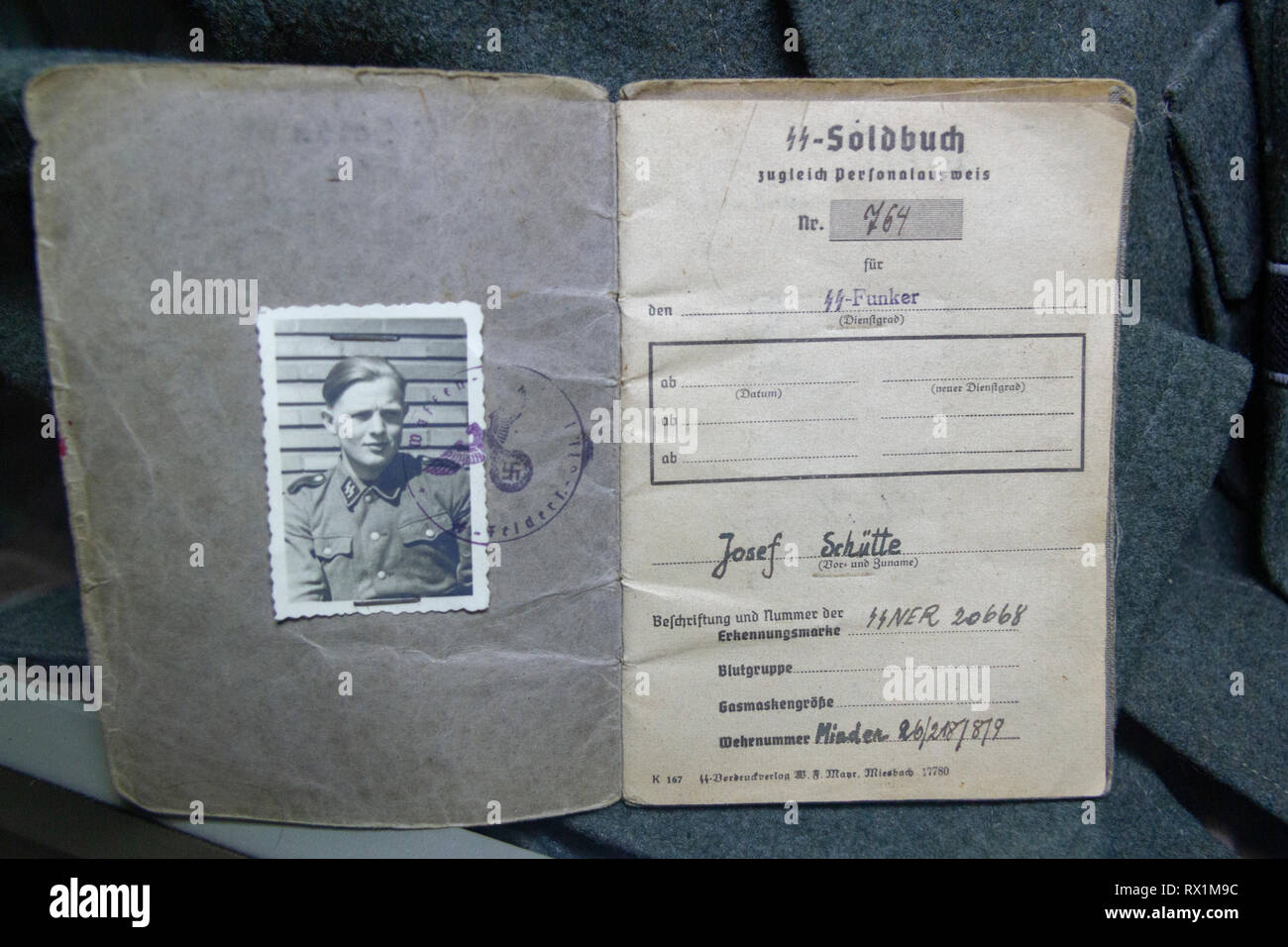 The identification papers of a German SS-Funker (radio operator/radio corps), in the Overlord Museum,  Colleville-sur-Mer, France. Stock Photo