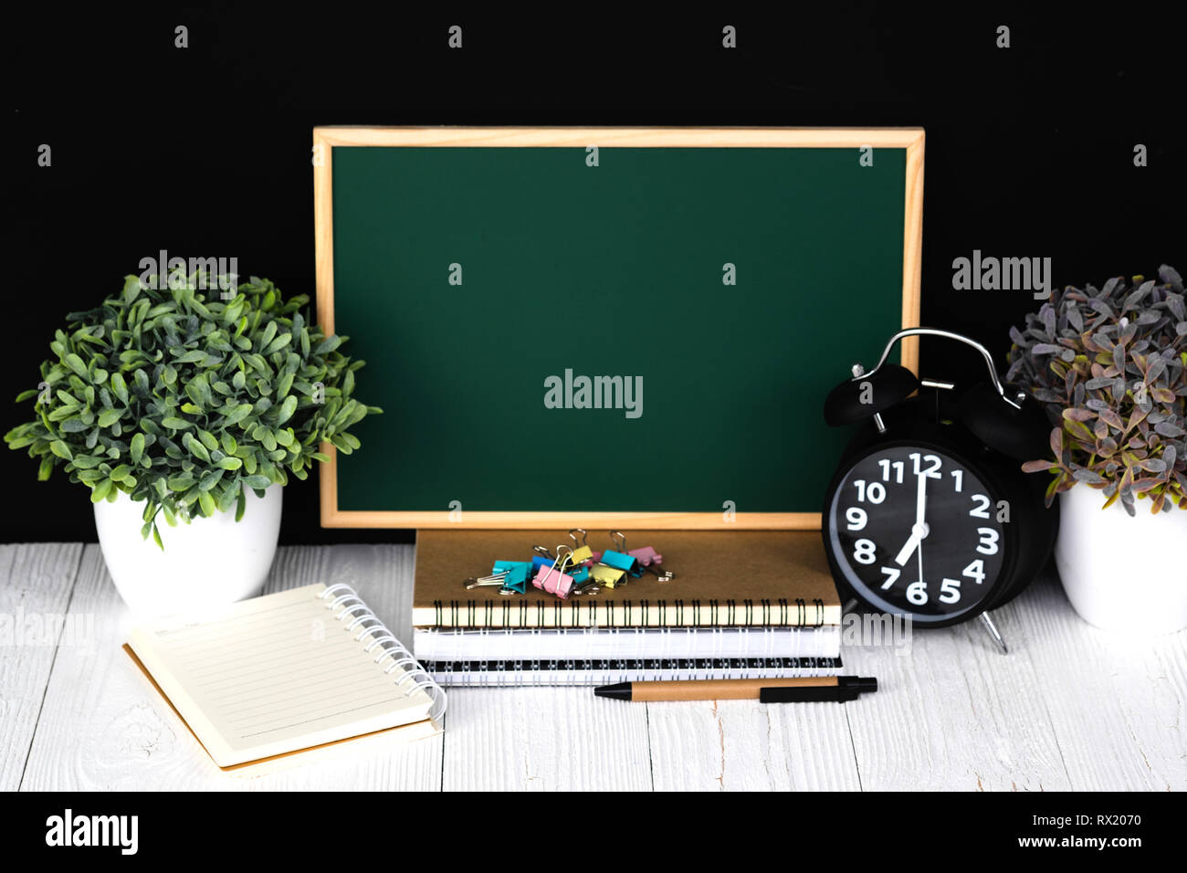 Back to school and education concept idea, green chalkboard with pile ...