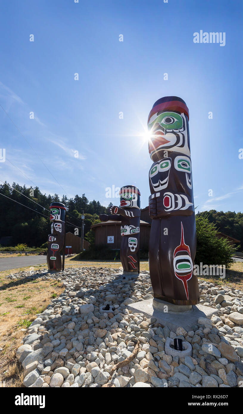 Totem Poles greet visitors to the first nations Nuyumbalees Cultural Centre on Quadra Island.  British Columbia, Canada Stock Photo