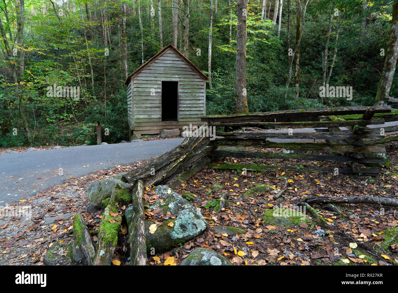 Log Fence & Small Cabin Stock Photo