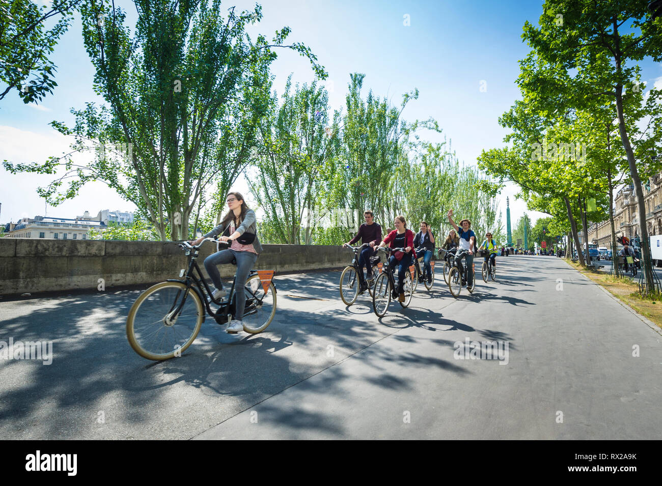 Bicycle group tour on Seine River embankment Stock Photo