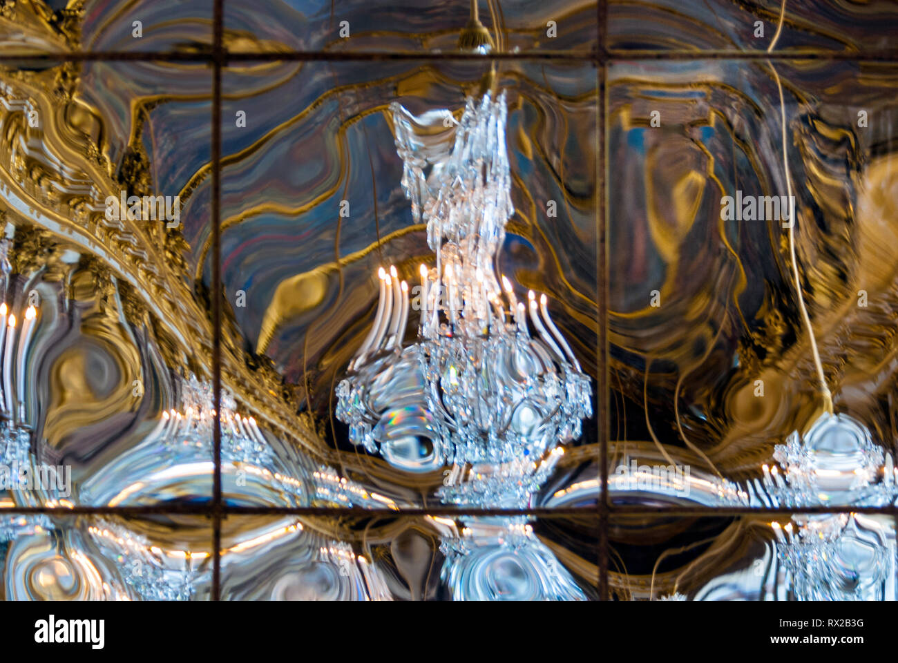 Distorted reflection in Versailles Palace Hall of Mirrors Stock Photo