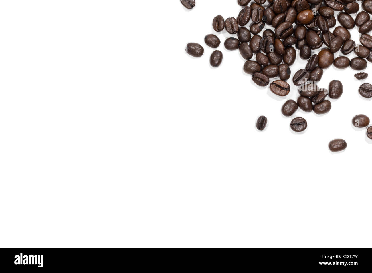 Top view Roasted coffee beans is a frame pattern isolated on white background. Stock Photo