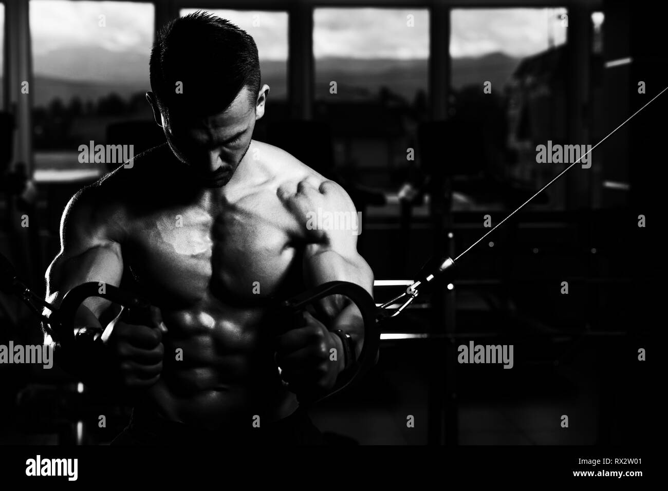 Young muscular men flexing abdominal Black and White Stock Photos & Images  - Alamy