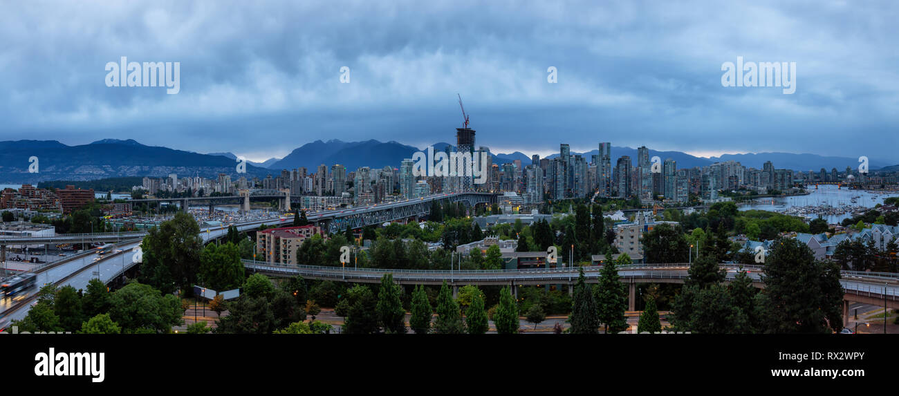 Aerial panoramic view of Downtown City during a cloudy summer sunset ...