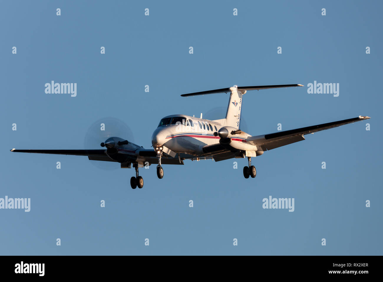 Royal Flying Doctors Service of Australia Beechcraft Super King Air 200 twin engined turboprop aircraft on approach to land at Adelaide Airport. Stock Photo