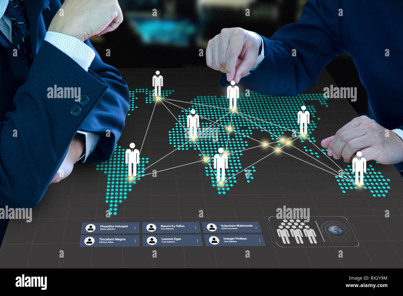 Two business administrator moving a pawn on a digital map as a virtual dashboard forming a business teamwork and business expansion strategy planning. Stock Photo