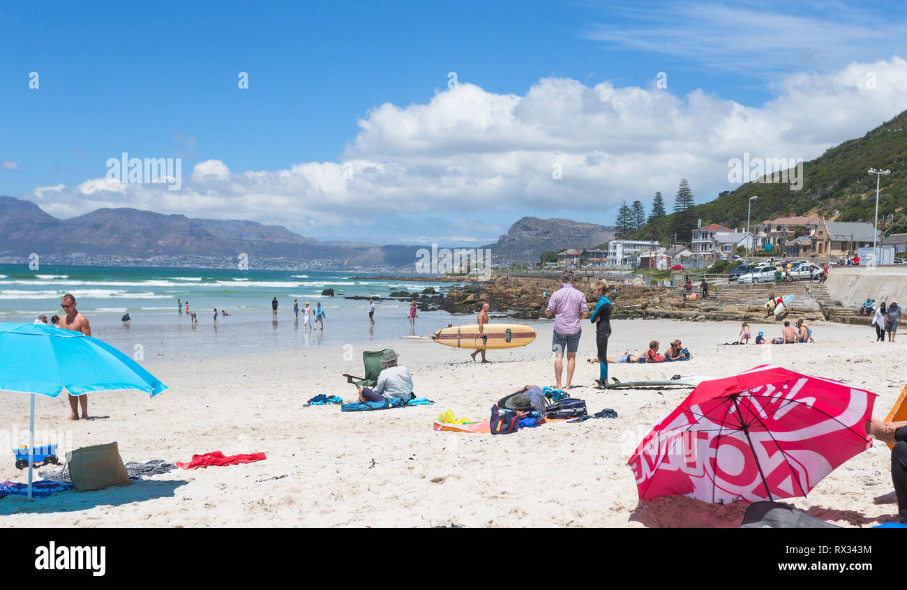 beachgoers or people enjoying a sunny Summer day of beach fun and relaxation at Muizenberg, False Bay, Cape Peninsula, Cape Town, South Africa Stock Photo