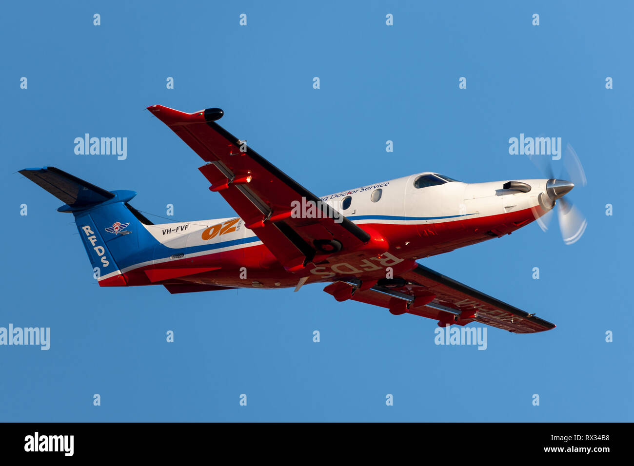 Royal Flying Doctors Service of Australia Pilatus PC-12 single engine air ambulance aircraft taking off from Adelaide Airport. Stock Photo