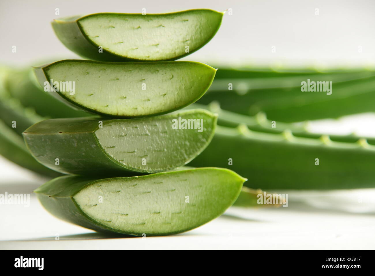 Fresh green aloe vera leaf slices .Ayurveda herbs background Stock Photo -  Alamy