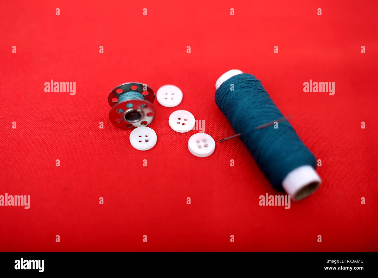 Picture of one sewing thread, needle, bobbin and button. Isolated on ...