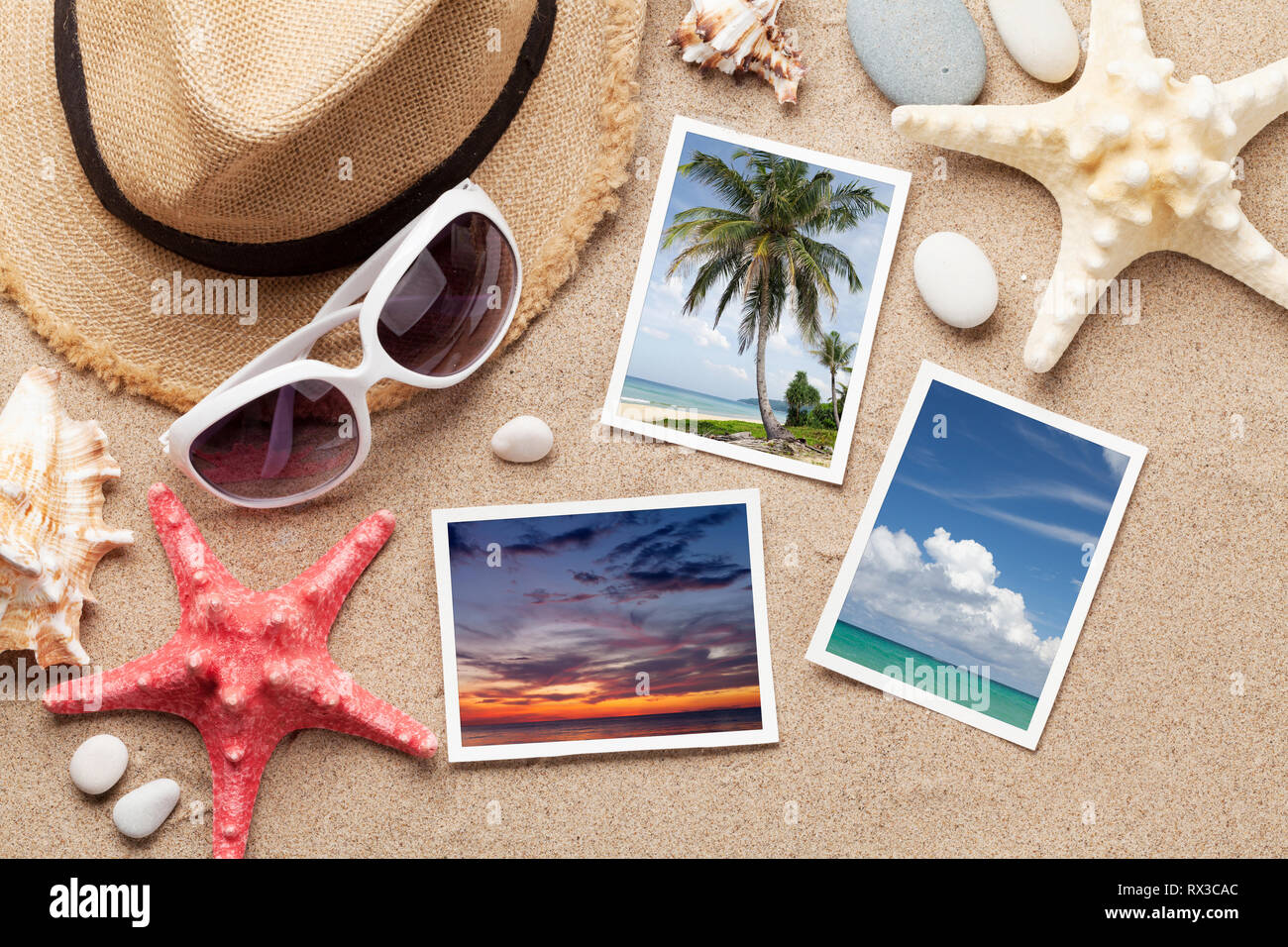 Travel vacation concept with hat, sunglasses, seashells and photos on sand backdrop. Top view. Flat lay. All photos taken by me Stock Photo