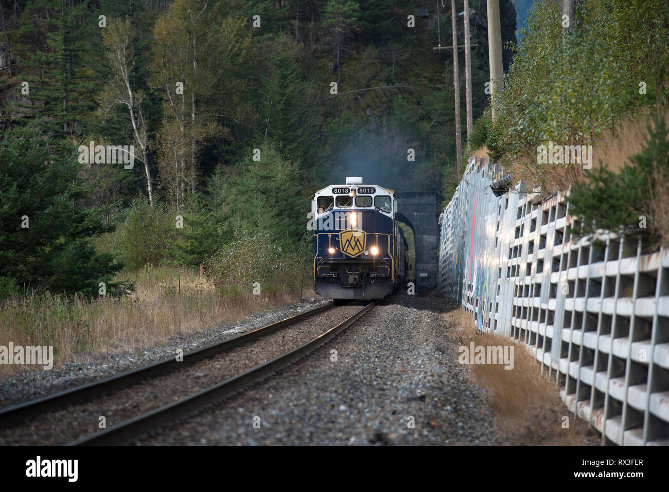 The Rocky Mountaineer exits a tunnel in the Fraser Valley near Hope, BC, Canada Stock Photo