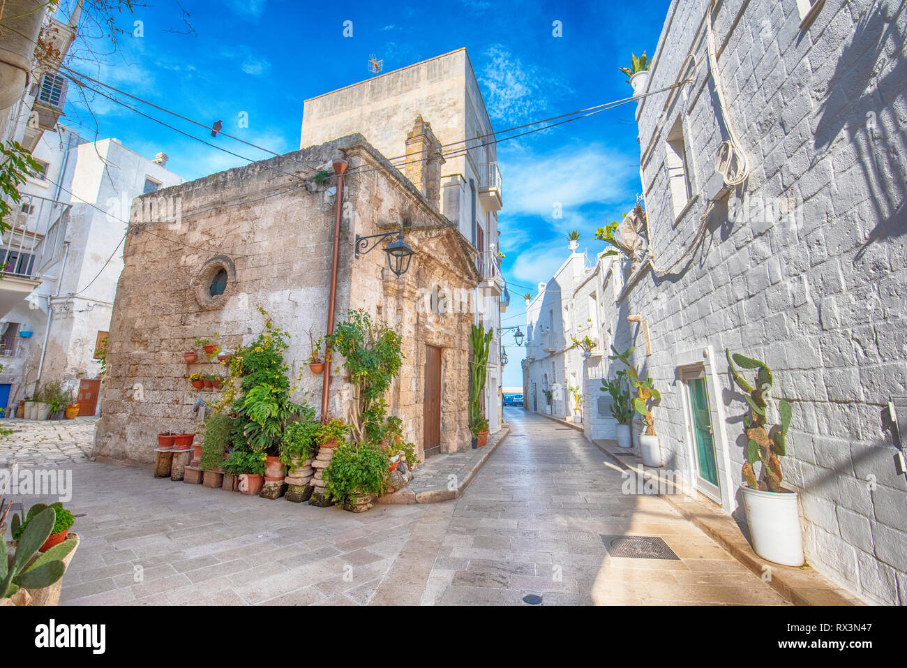 Monopoli, Puglia, Italy - Street and alley with a view of colorful houses  in the old town. A region of Apulia Stock Photo - Alamy