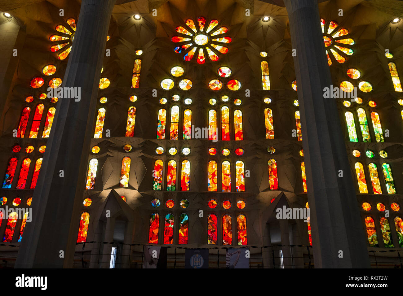 The stunning interior atrium and stained glass of Antonio Gaudi's Sagrada Familia church in Barcelona, Spain. Stock Photo