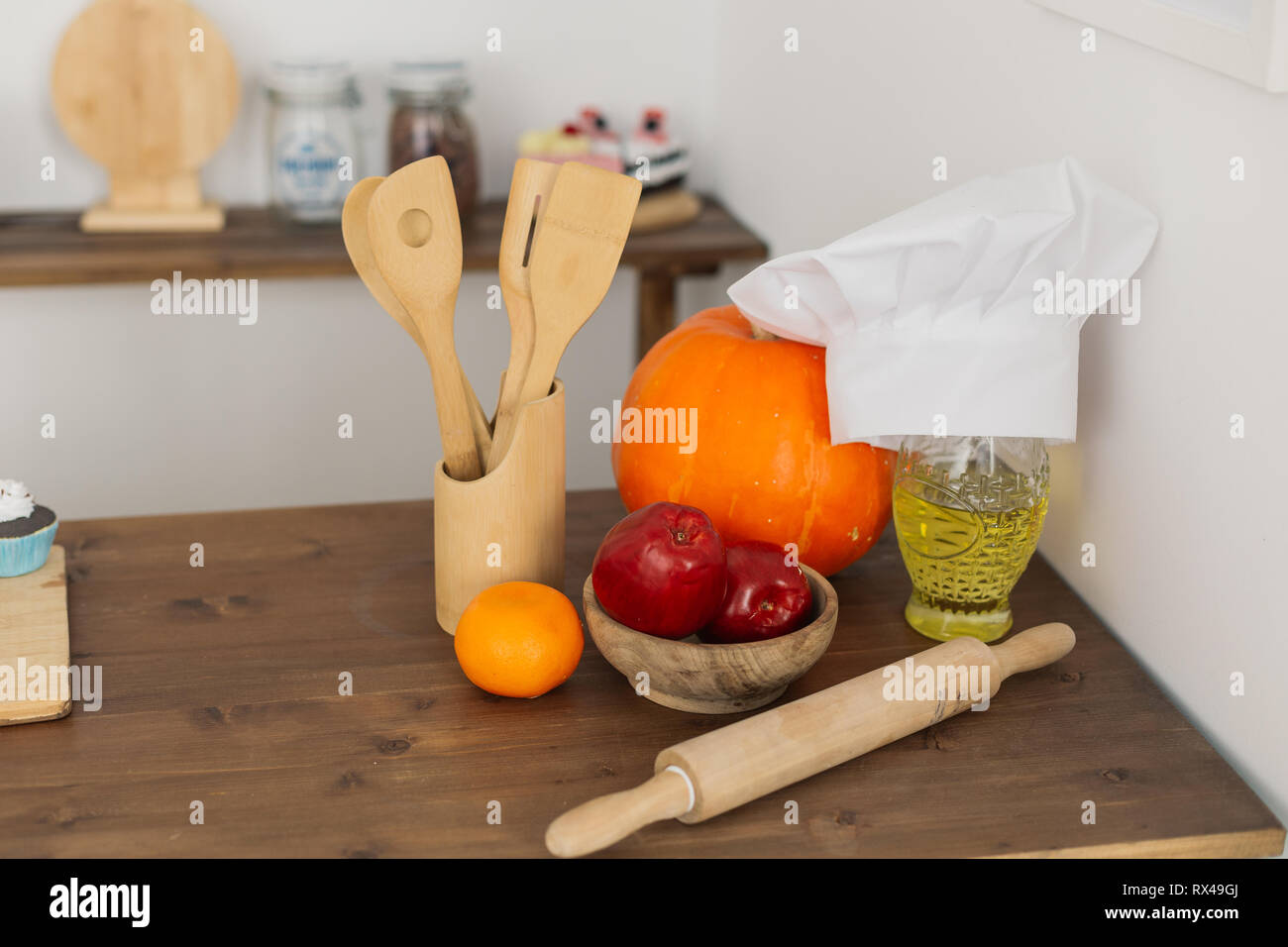 Kitchen corner with wooden spoons rolling pin and chef's hat Stock ...