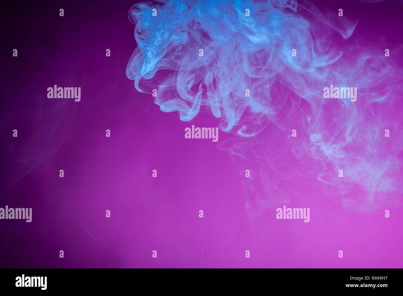 Blue bomb smoke on pink isolated background Stock Photo - Alamy