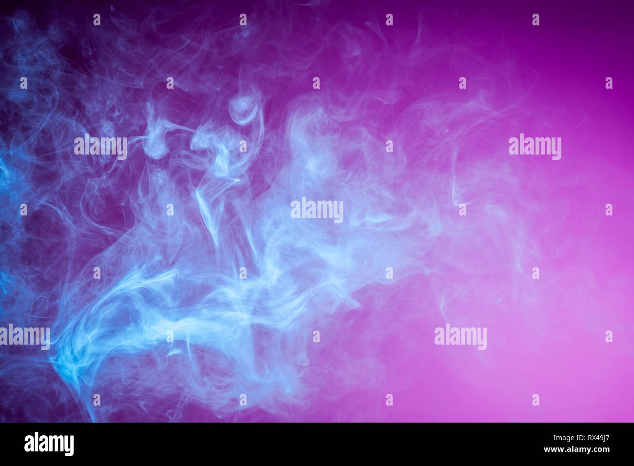 Blue bomb smoke on pink isolated background Stock Photo - Alamy