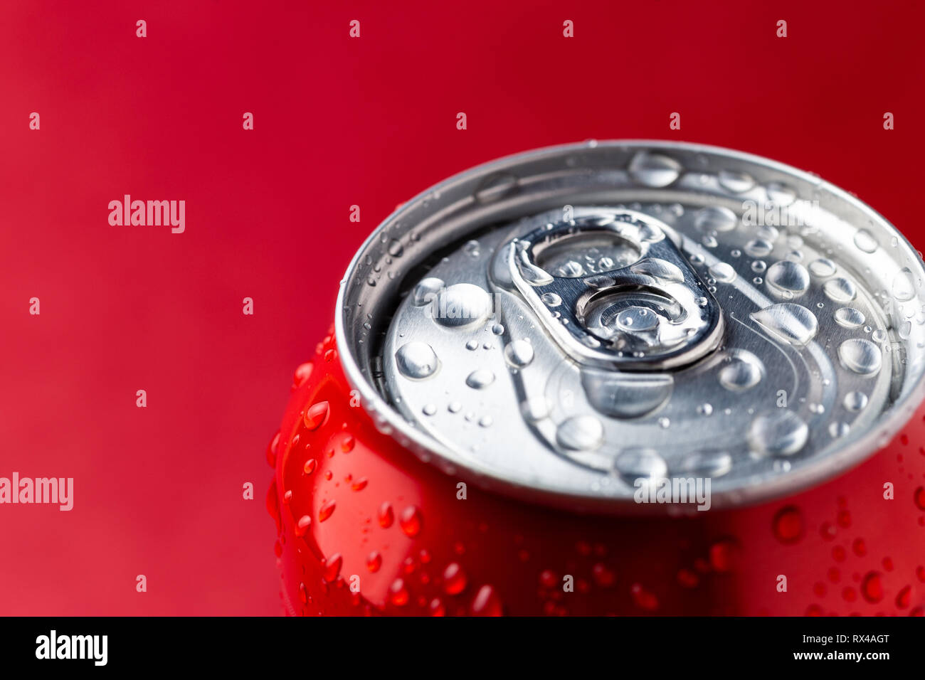 Macro view of water condensation over red aluminium can with copy space Stock Photo