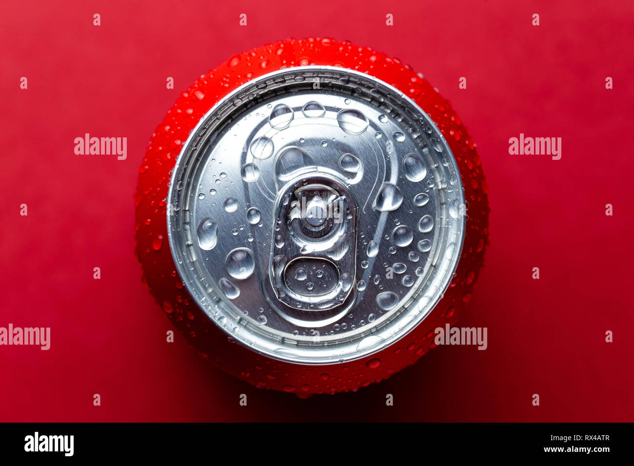 Aluminum soda can top view on an red background. Top view with place fot text Stock Photo