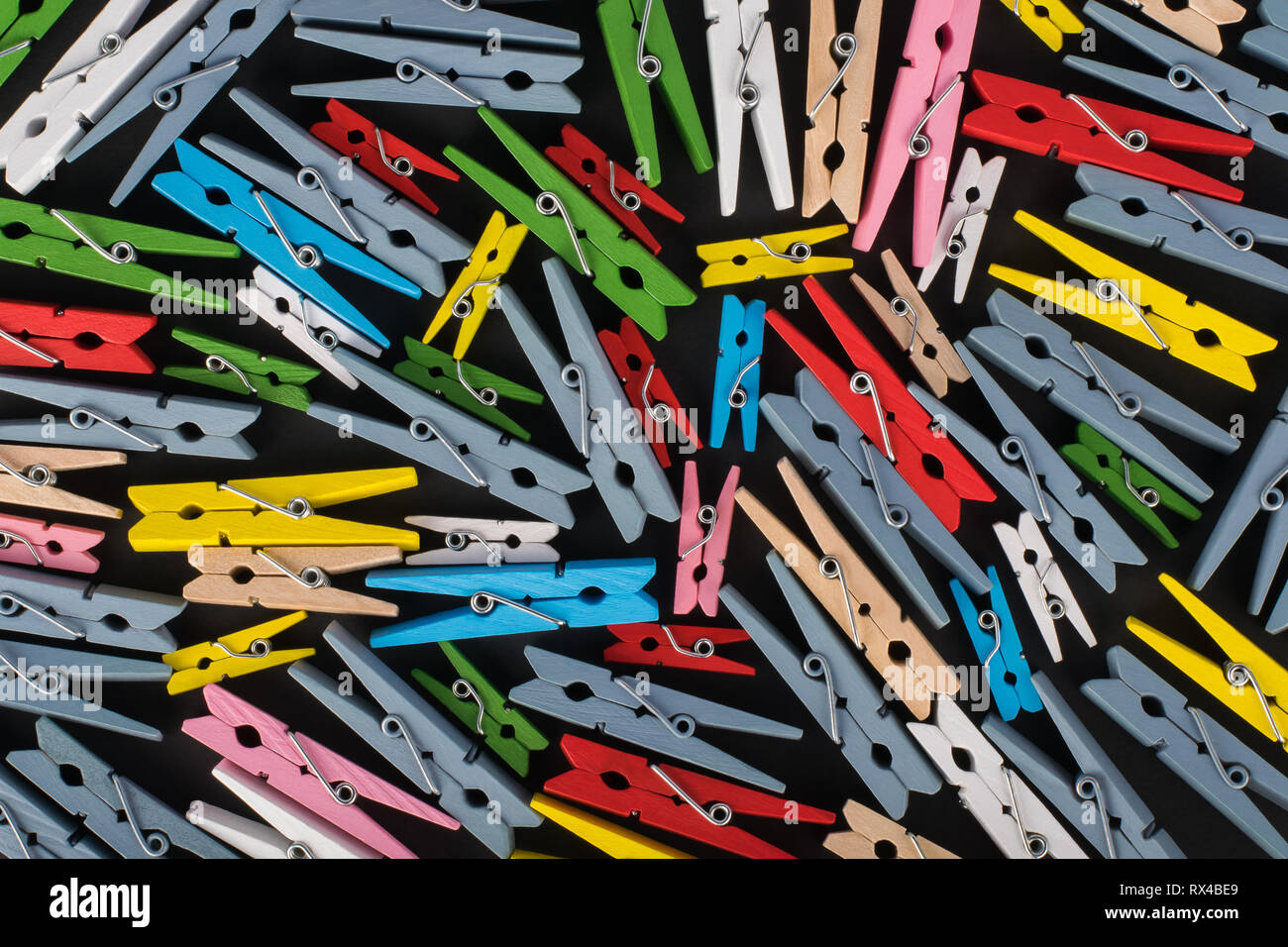 Abstract multicolored background with wooden clothes pins Stock Photo
