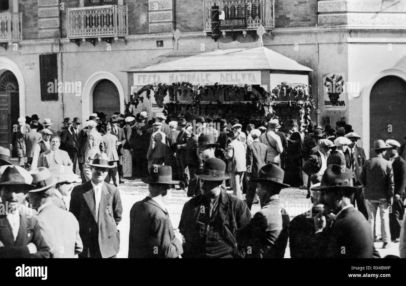 Europe, Italy, Calabria, Rossano, men in public for the grape festival, 1920-30 Stock Photo